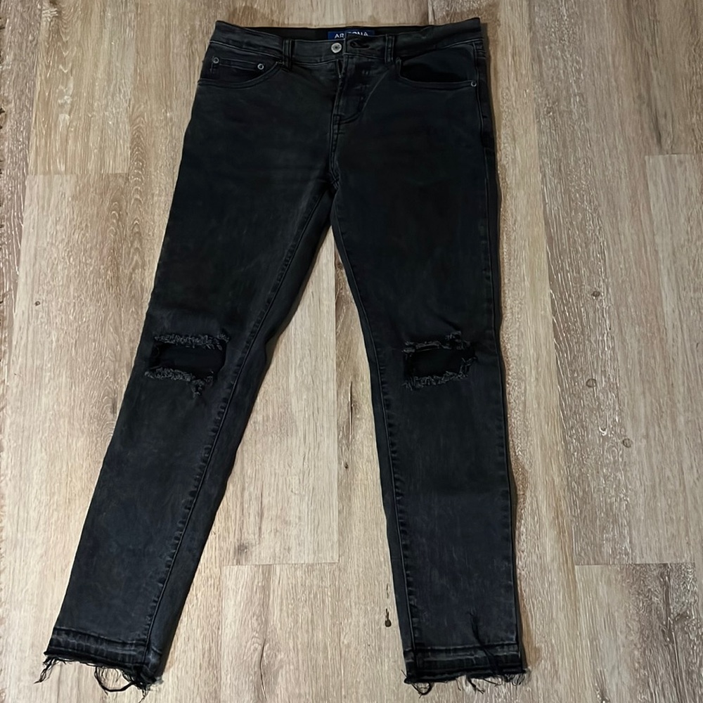 Arizona Jean Co. distressed jeans with frayed hem.